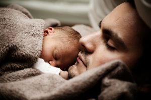 father holding newborn child